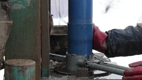 The machine collects blue threaded pipes Stock Footage 145518252