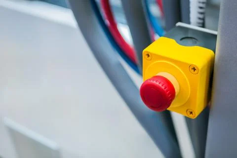 Machine control panel with red switch button - emergency stop at factory Stock Photos