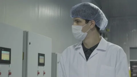 Machine control of worker / engineer in white uniform 스톡 동영상 135272657