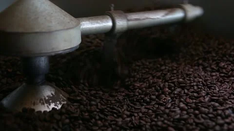 A machine that is cooling beans of coffee that are recently roasted Stock Footage 140759550
