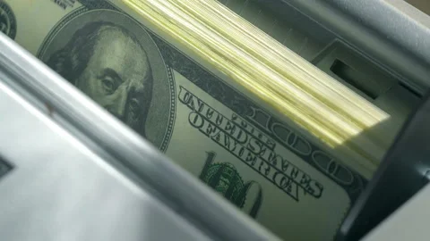 Machine counter automatic calculates a large amount of Dollar banknotes in 4K Stock Footage 155735325
