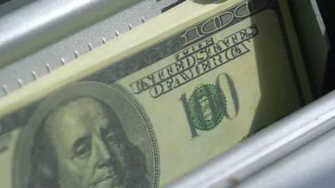 Machine counter automatic calculates a large amount of Dollar banknotes in 4K Stock Footage 155735544