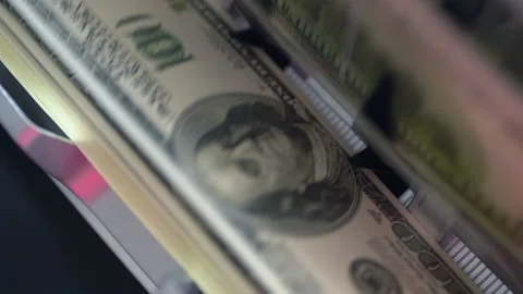 Machine counter automatic calculates a large amount of Dollar banknotes in Slow Stock Footage 155736055