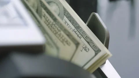 Machine counter automatic calculates a large amount of Dollar banknotes in Slow Stock Footage 155736589