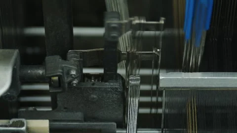 Machine creating fabric and textile with thread in a factory Stock Footage 291870528