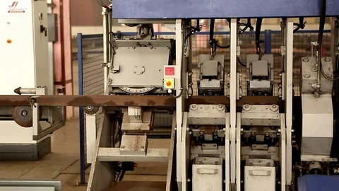 The machine cuts the triangular metal profile Stock Footage 76950955