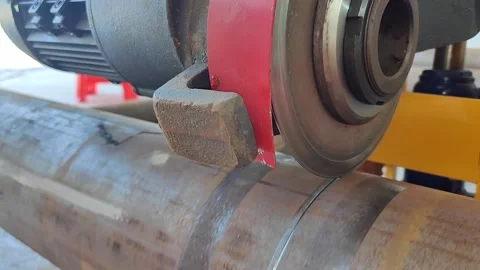 Machine cutting a large circular pipe at horizontal composition with sound Stock Footage 321641902