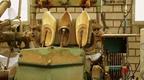 Machine is cutting out the inside of clogs Stock Footage 46998589