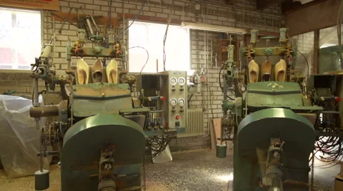 Machine is cutting out the inside of clogs Stock Footage 47077004