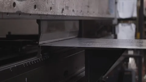 A machine is cutting a piece of metal Stock Footage 302458166