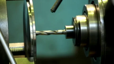 Machine drill makes a hole in a steel circle Stock Footage 76856892