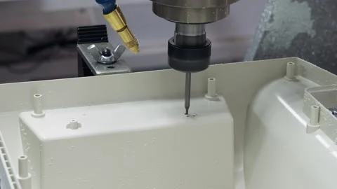 The machine drills holes in a plastic part. Stock Footage 130241508