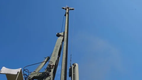 The machine drives a pile wooden structure into the ground. Construction of the  Stock Footage 123871114