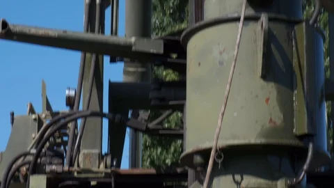 The machine drives a pile wooden structure into the ground. Construction of the Stock Footage 123871679