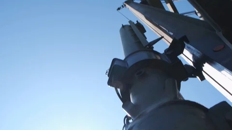 The machine drives a pile wooden structure into the ground. Construction of the Stock Footage 123871687