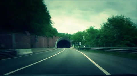 Machine drives into a tunnel Vídeos de archivo 24590525
