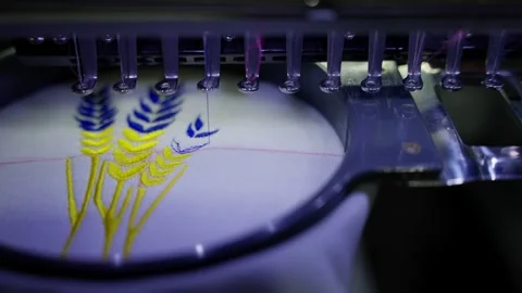 Machine embroiders floral pattern on fabric. Concept of embroidery automation Stock Footage 270567109