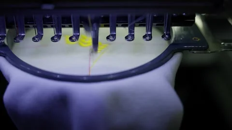 Machine embroiders floral pattern on fabric. Concept of embroidery automation Stock-Footage 274836842