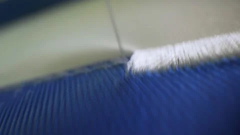 Machine embroiders pattern on uniform with white threads Stock Footage 143029122