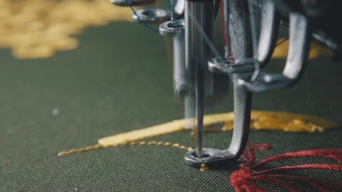 Machine embroidery is an embroidery process whereby a sewing machine Video stock 74105497