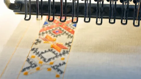 Machine embroidery is an embroidery process whereby a sewing machine or Stock Footage 127753992