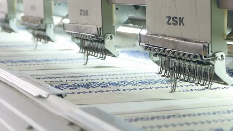 Machine embroidery is an embroidery process whereby a sewing machine or Stock Footage 128436009
