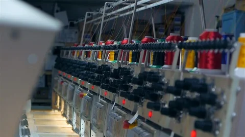 Machine embroidery is an embroidery process whereby a sewing machine or Stock Footage 128436499