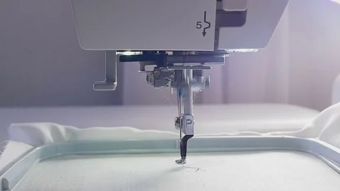 Machine embroidery work.Working embroidery machine. Textile - Professional and Stock Footage 77626118