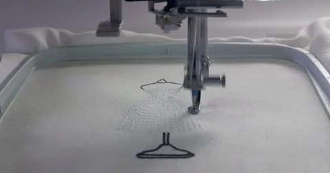 Machine embroidery work.Working embroidery machine. Textile - Professional and Video stock 77626327