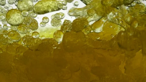 Machine engine oil mixed with water, not dissolve. Bubbles air bulbs float in 動画素材 136392960