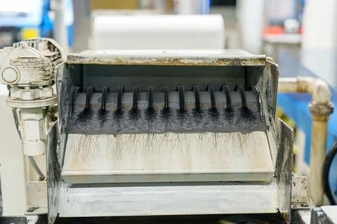 Machine in factory for processing materials at a manufacturing site in the .. Stock Photos