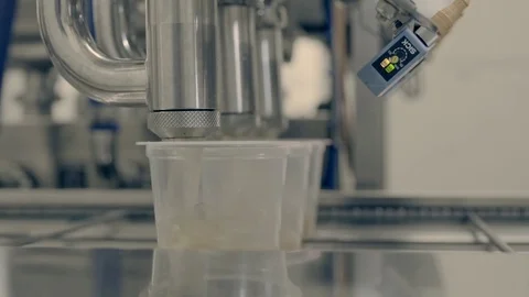 Machine filling cans with soup Stock Footage 78032685