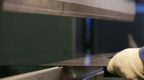 Machine flexes metal sheet Stock Footage 46169204