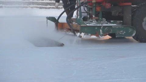 The machine floods the ice rink in the winter Stock Footage 88433905