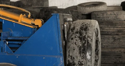Machine is getting metal wires from the inside of old rubber car tire on plant. Stock Footage 129903053