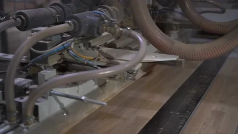 A machine for gluing small planks together to form a thin wooden board. Stock Footage 144470074