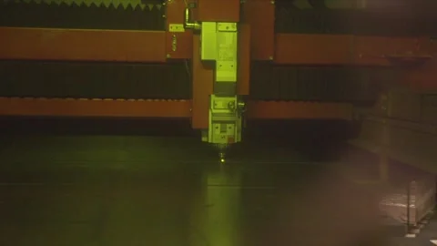 A machine with a green light is in a dark room Stock Footage 302457206