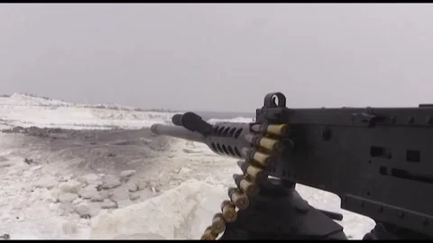 A machine gun firing at a winter training ground. Stock Footage 325566582