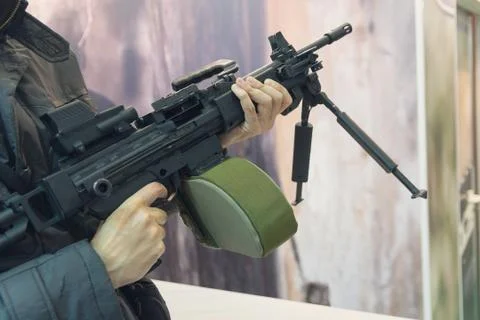 Machine gun in the hands of a man. Weapons Stock Photos