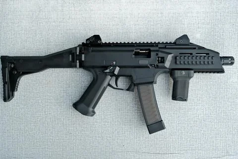 Machine gun is on the table. machine gun close-up. military weapon. Stock Photos