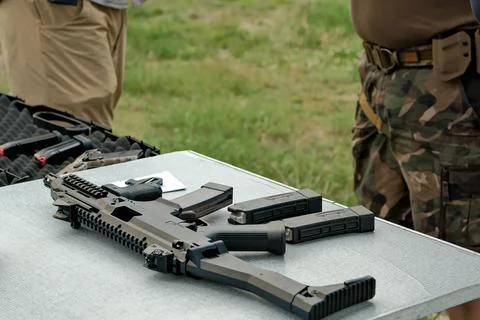 Machine gun is on the table. machine gun close-up. military weapon. Stock Photos