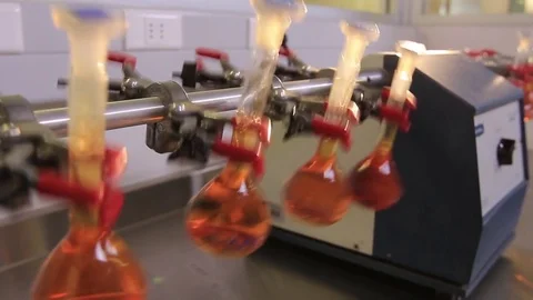 Machine handling test tubes in lab Stock Footage 77046821