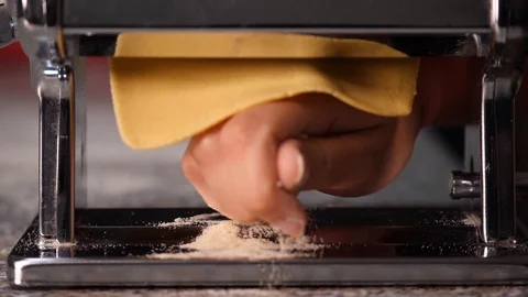 Machine for handmade Pasta sprinkled with flour - slow motion Stock Footage 98177787