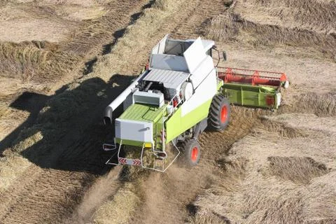 Machine harvesting the corn field Stock Photos
