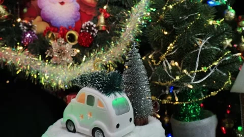 The machine has a Christmas tree and a deer rotating near the Christmas trees Stock-Footage 286298382