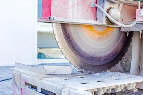 Machine has sharp blade which makes clean cut in stone or granite. Stock Photos