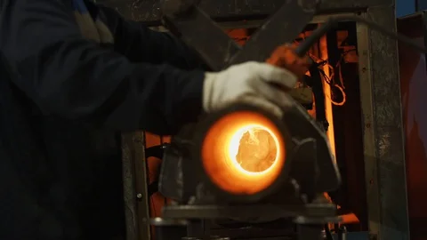 The machine heats the cast iron pipe Stock Footage 128351563