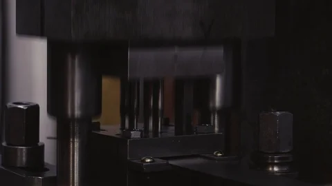 Machine with the help of a man stamps metal parts from the workpiece. Close-up Stock Footage 115907457