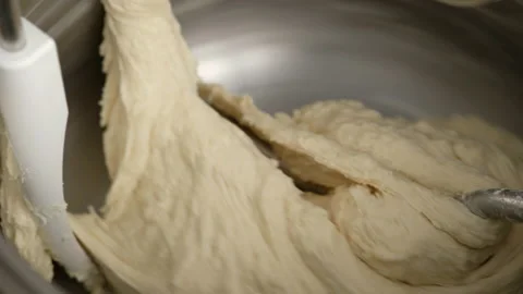 Machine knead bread dough. Raw dough in a industrial bakery dough mixer, food Stock Footage 141341031