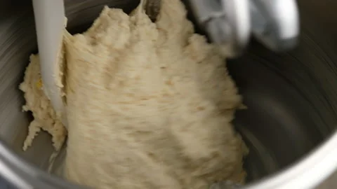 Machine knead bread dough. Raw dough in a industrial bakery dough mixer, food Stock Footage 145481680